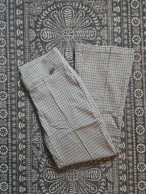 Plaid pleated flare pant in black, cream, and brown